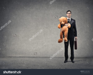 stock-photo-young-businessman-with-big-teddy-bear-and-briefcase-on-gray-background-138016865